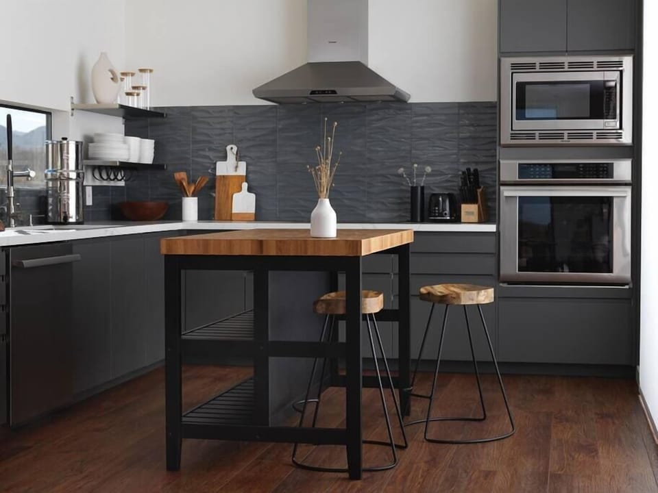 Prepare culinary masterpieces in our elegant designer kitchen, where style and functionality converge seamlessly. The well-appointed space features sleek countertops, high-end Thermador appliances, and ample storage for all your cooking essentials.