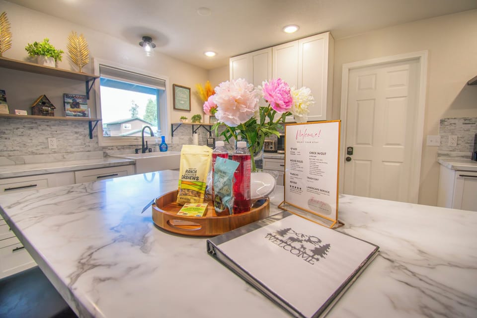 Spacious kitchen island with a welcome binder and helpful information provided.