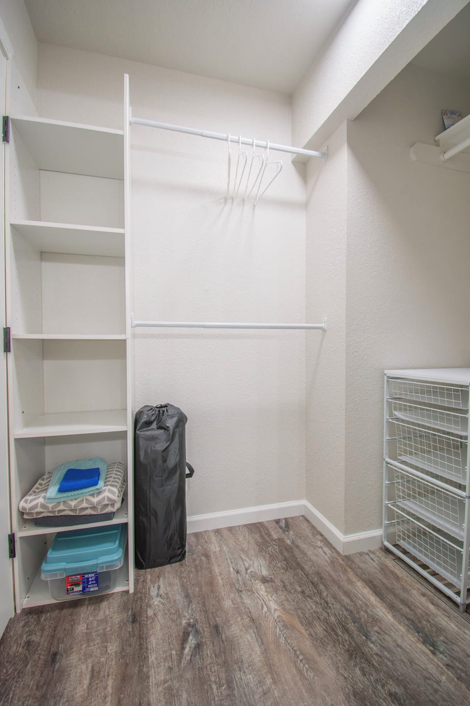 Spacious primary bedroom closet with plenty of room.