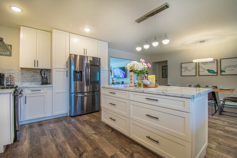 Kitchen with center island and stainless-steel appliances.  