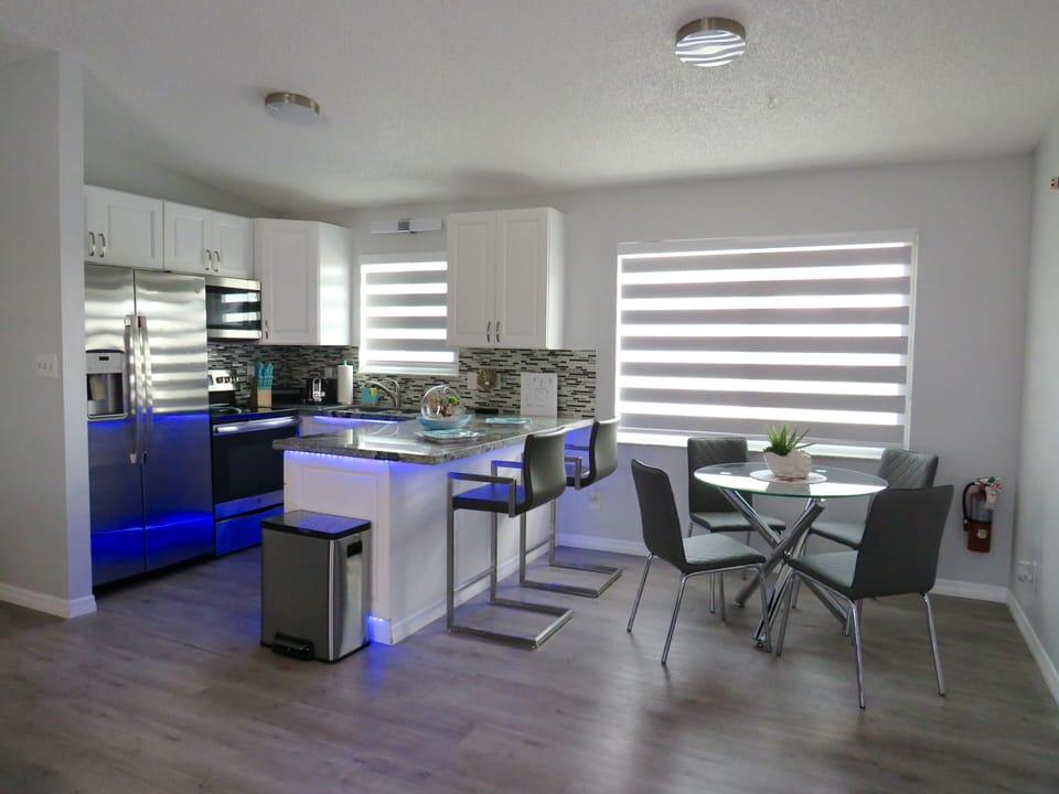Fully equipped kitchen with dining area.