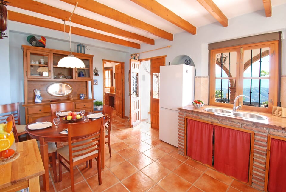 From the kitchen you step on the covered terrace.