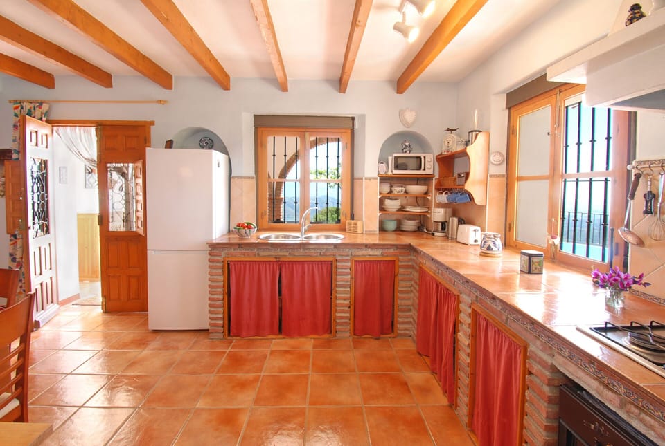 Our kitchen in Spanish style :  casual, rural but well equipped.