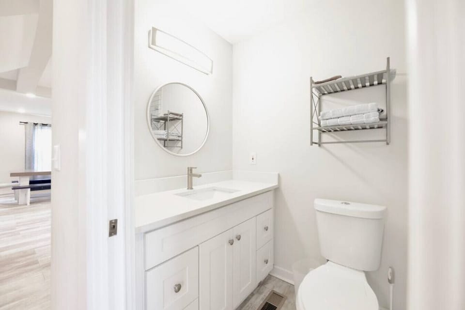 Downstairs bathroom across from the room with 2 full beds. Walk in shower