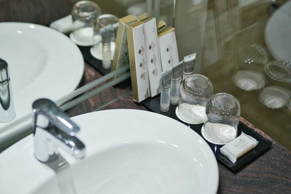 Shower, designer toiletries, hair dryer, slippers