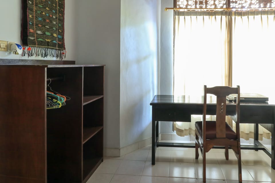 Family Apartment, Multiple Beds, Garden View | Minibar, in-room safe, desk, laptop workspace