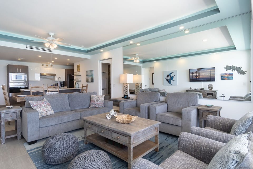 Living room seating and large mirror.