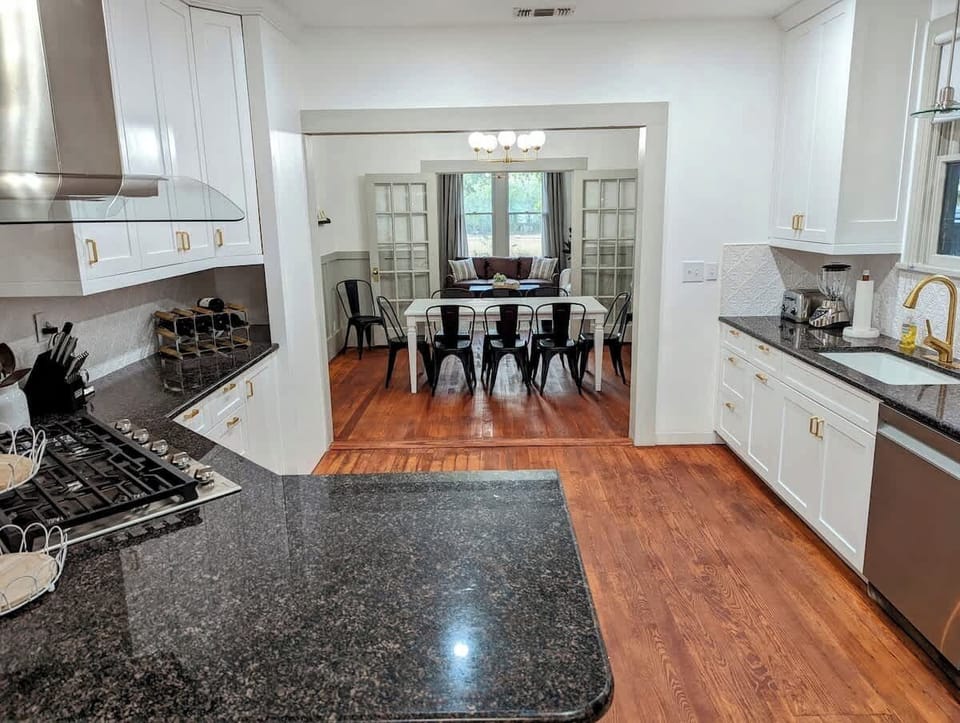 Efficient and stylish kitchen complete with stainless steel appliances and a high-performance gas stove.