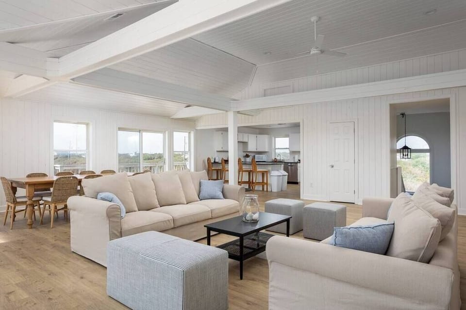 Top Level Bright Living Room w/ Smart TV, Panoramic Windows, and Cozy Seating