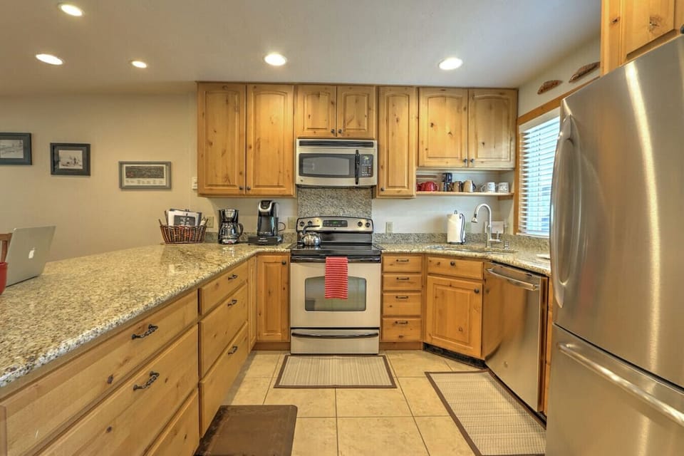 Well-equipped kitchen with stainless steel appliances and granite countertops