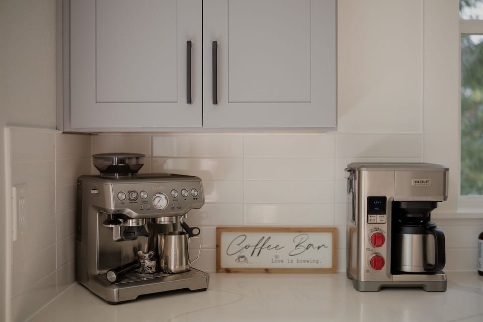 Slow mornings start here. Enjoy espresso or fresh coffee with our Breville espresso maker and luxury Wolf coffee maker.