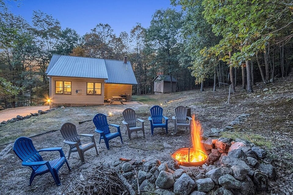 Backyard fire pit for spring, summer, and fall use, guests provide own wood.