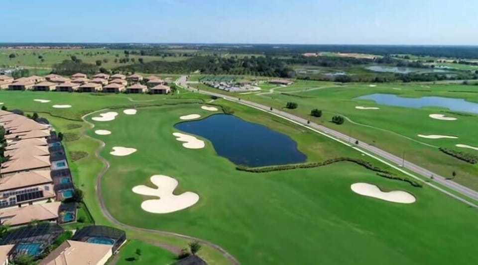 Enjoy stunning views from your vacation home, overlooking lush fairways and sparkling water. The tranquil landscape is ideal for relaxation, while the gentle contours of the golf course beckon you to explore the outdoors.