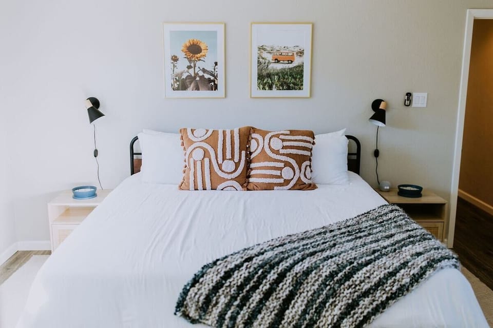 Primary bedroom with king bed, walk-in closet, and en-suite bathroom