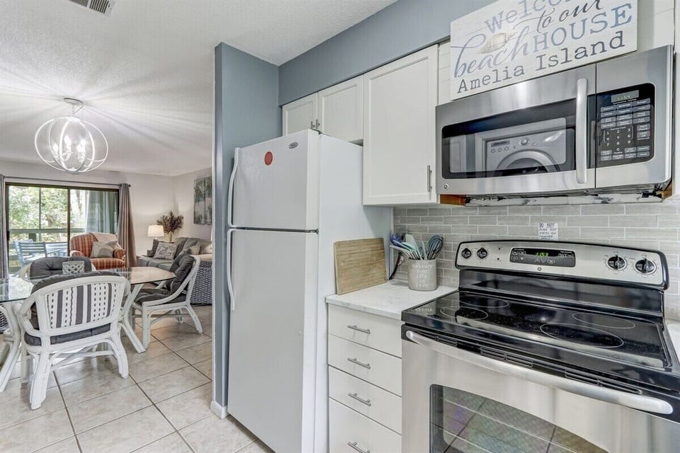 Bright White Cabinets in Sun-Filled Kitchen