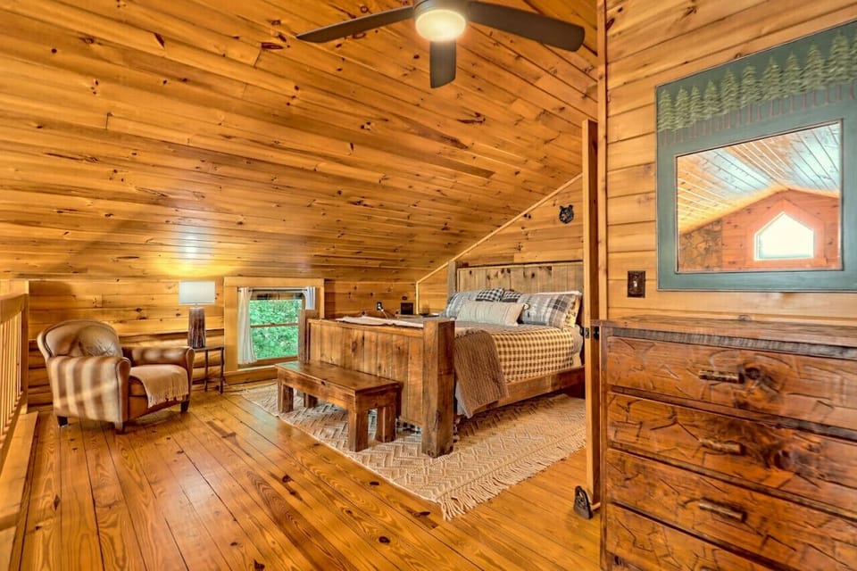 Cozy seating and reading area in the loft master bedroom, perfect for unwinding with a good book.