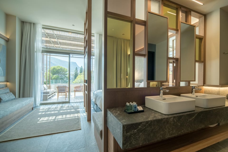 Petite Suite Sea View Outdoor Hot Tub | Bathroom | Shower, hair dryer, bathrobes, slippers