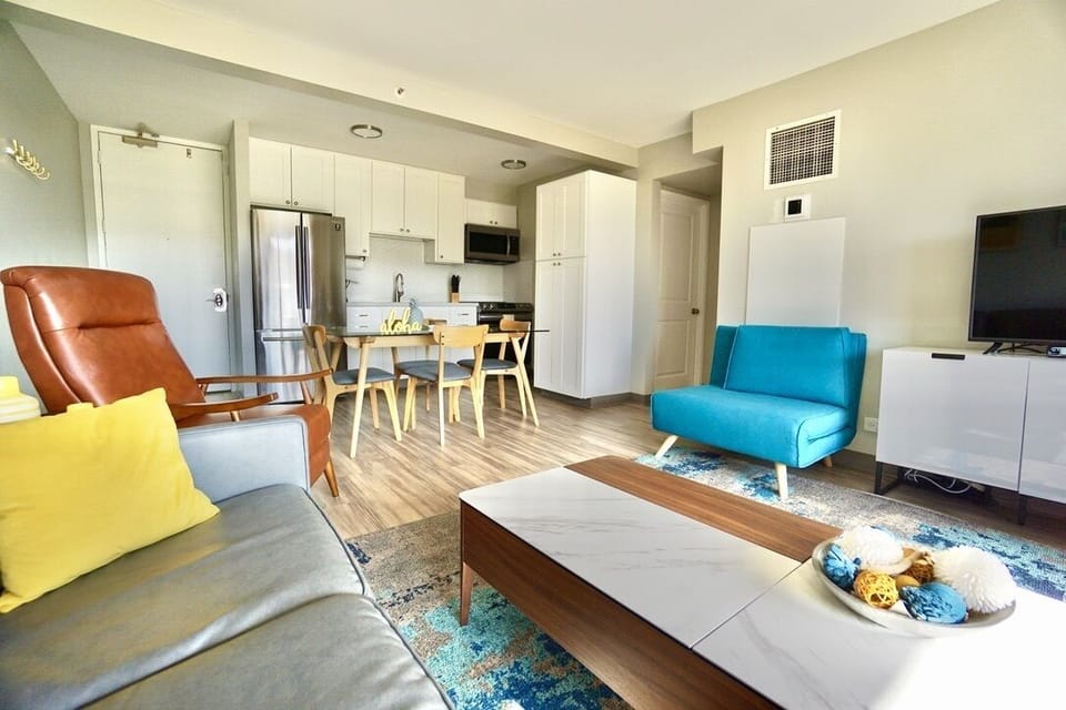 Spacious living room with dining table and recliner