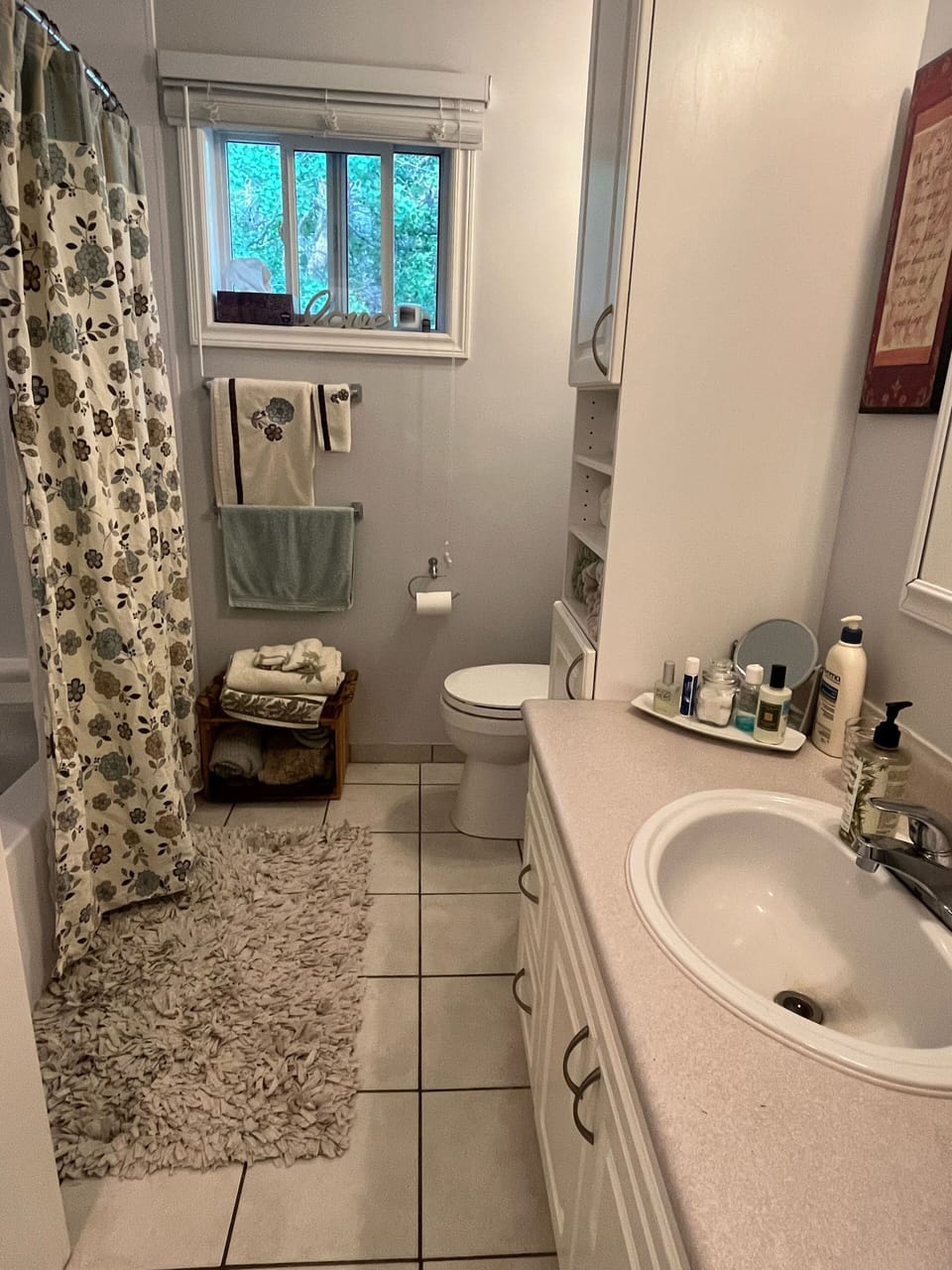 The large bathroom with plenty of towels .