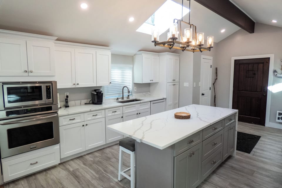 Chef's kitchen with wall oven and microwave