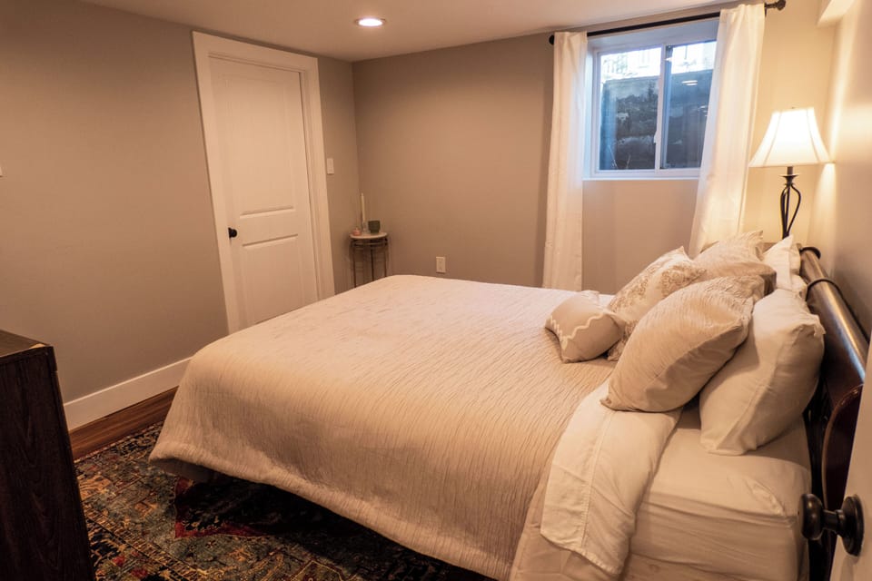 Downstairs bedroom 5 with queen bed