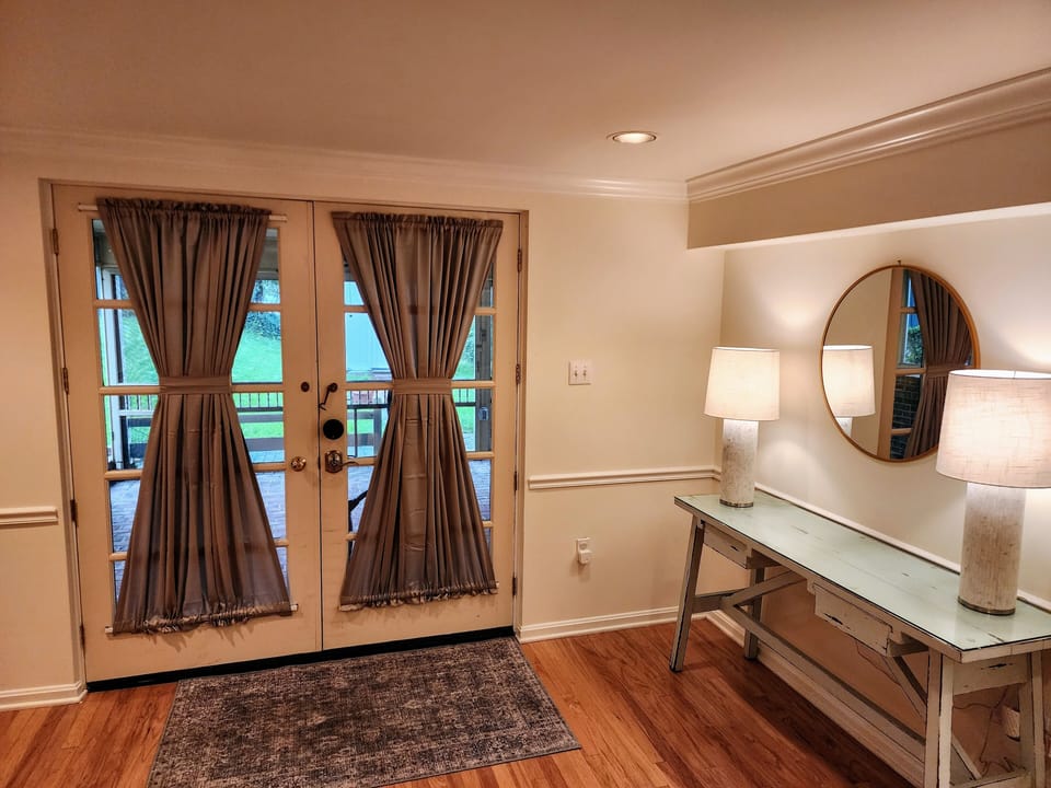 The entryway with privacy curtains for those that stay on the pull-out sofa.