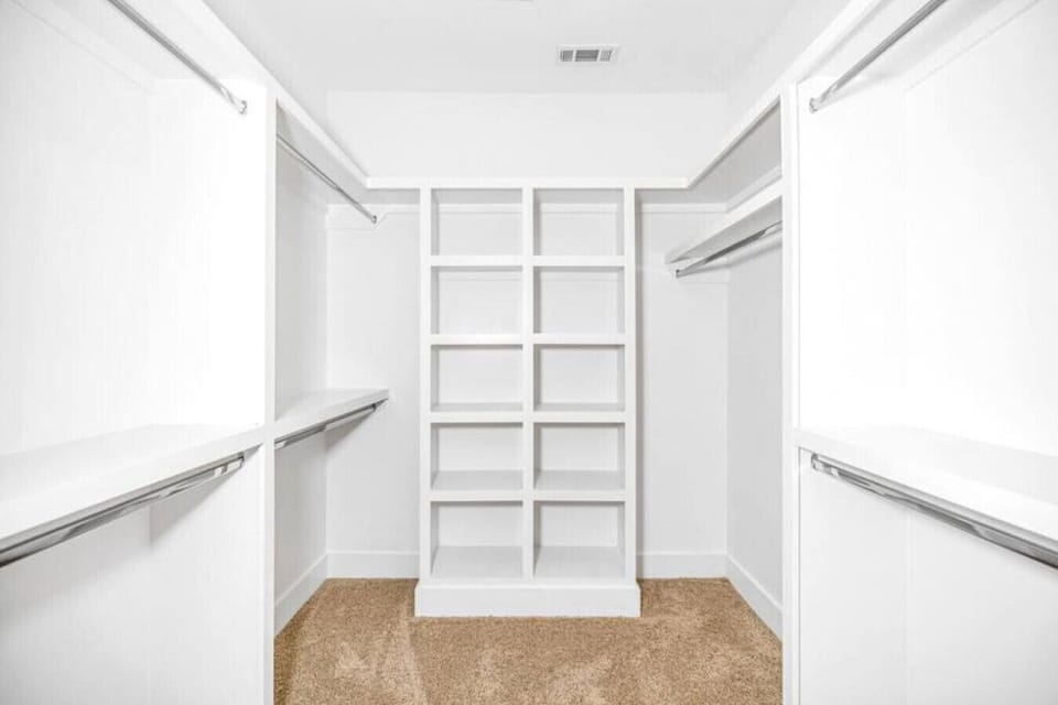Walk in closet in the primary bedroom