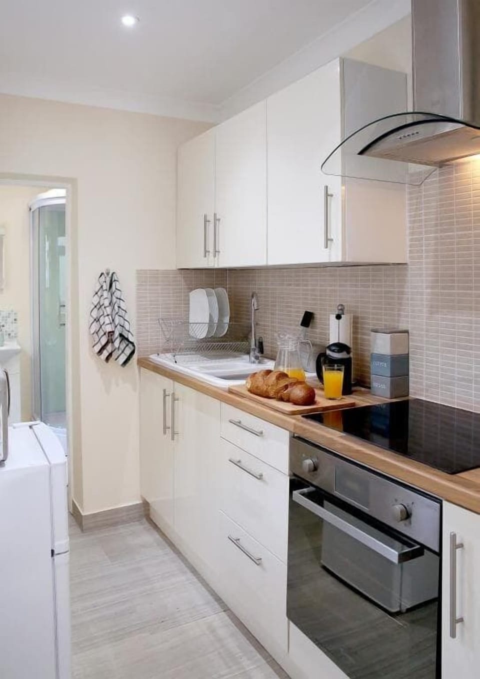 The apartment's well-equipped kitchen ensures your comfort while preparing delicious meals throughout your stay.