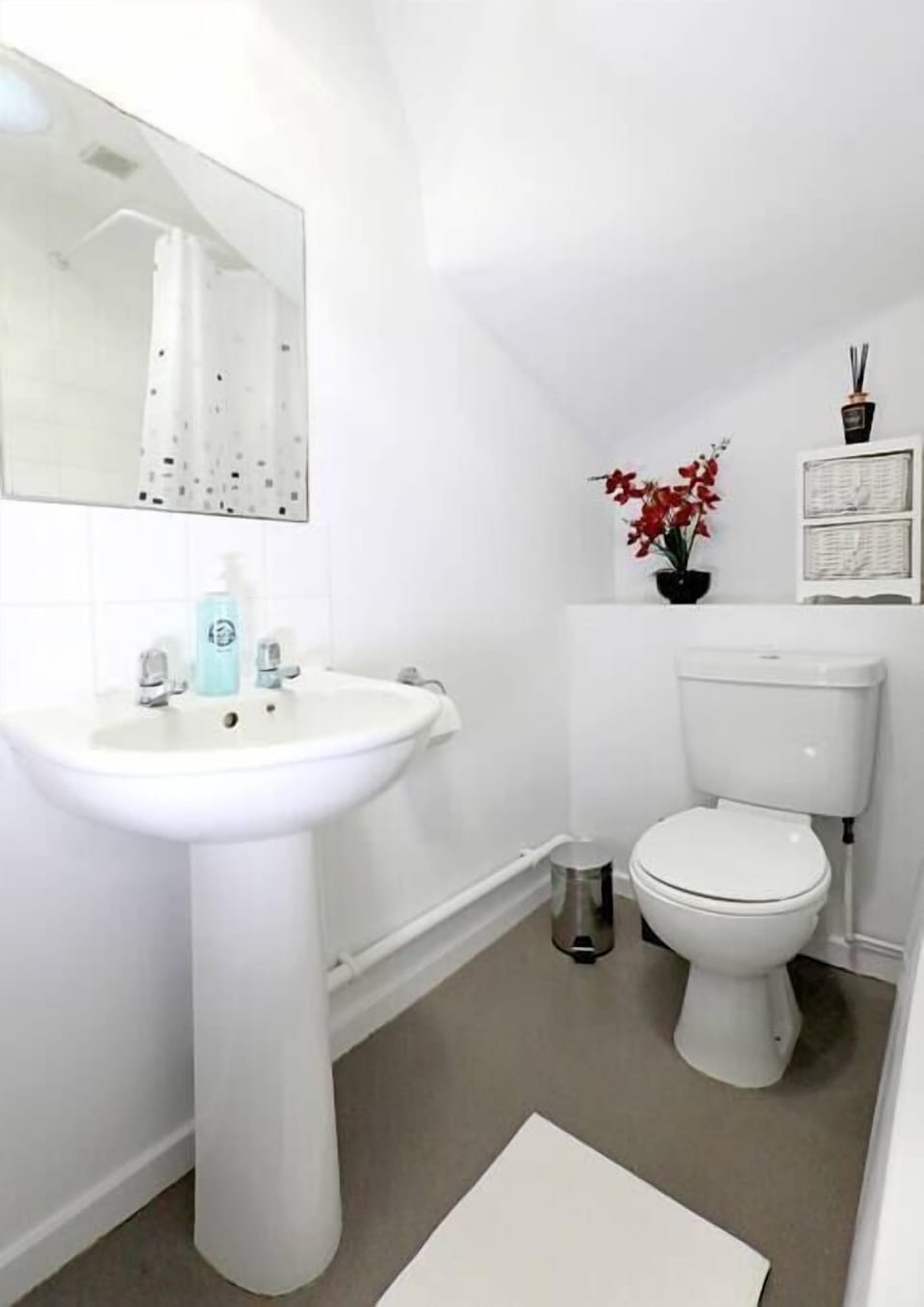 Bathroom with bath and overhead shower - toiletries and soaps are provided 