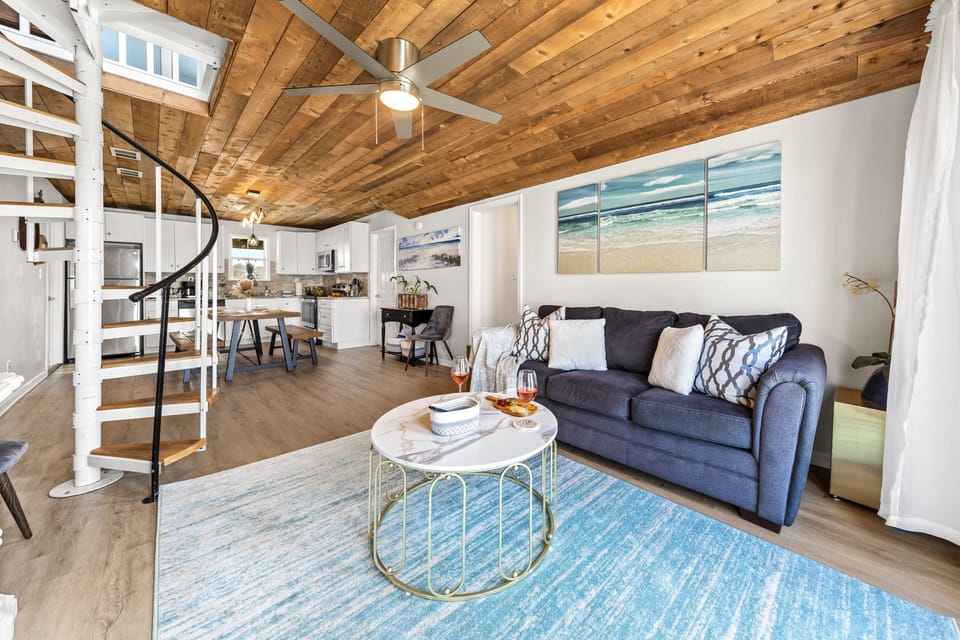 Beautiful modern open floor plan, ceiling and spiral stairs.