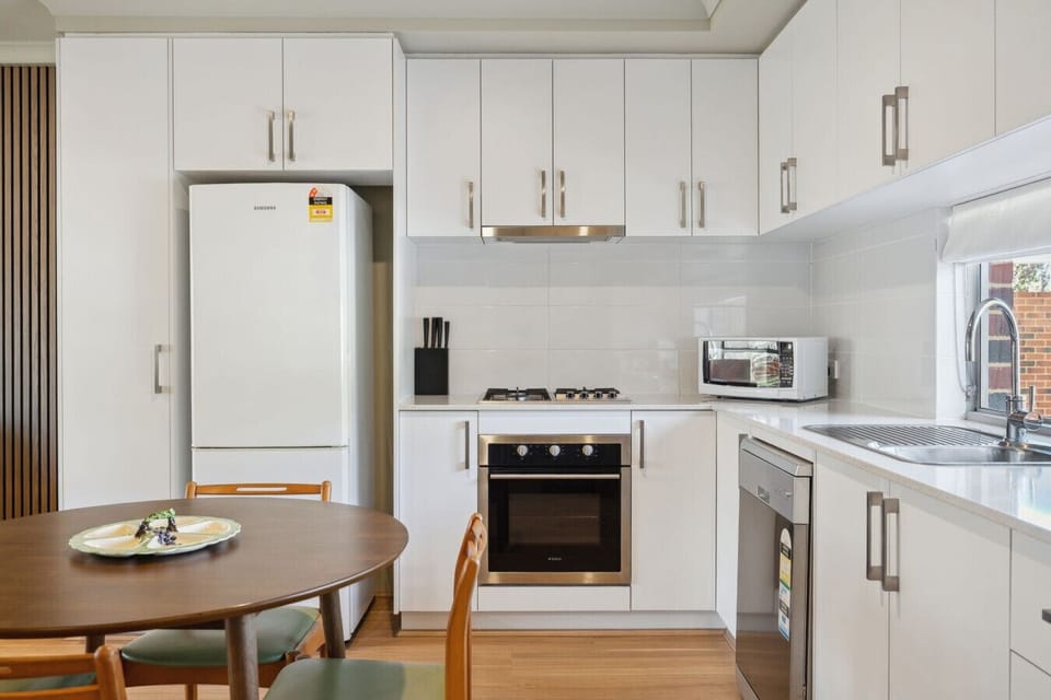 Fully equipped kitchen with open dining space