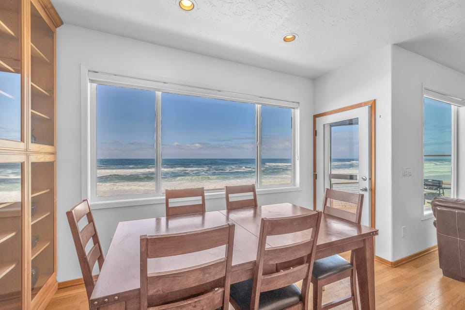 Savor your morning coffee at this ocean-view dining table, where endless waves become your backdrop for every meal together.