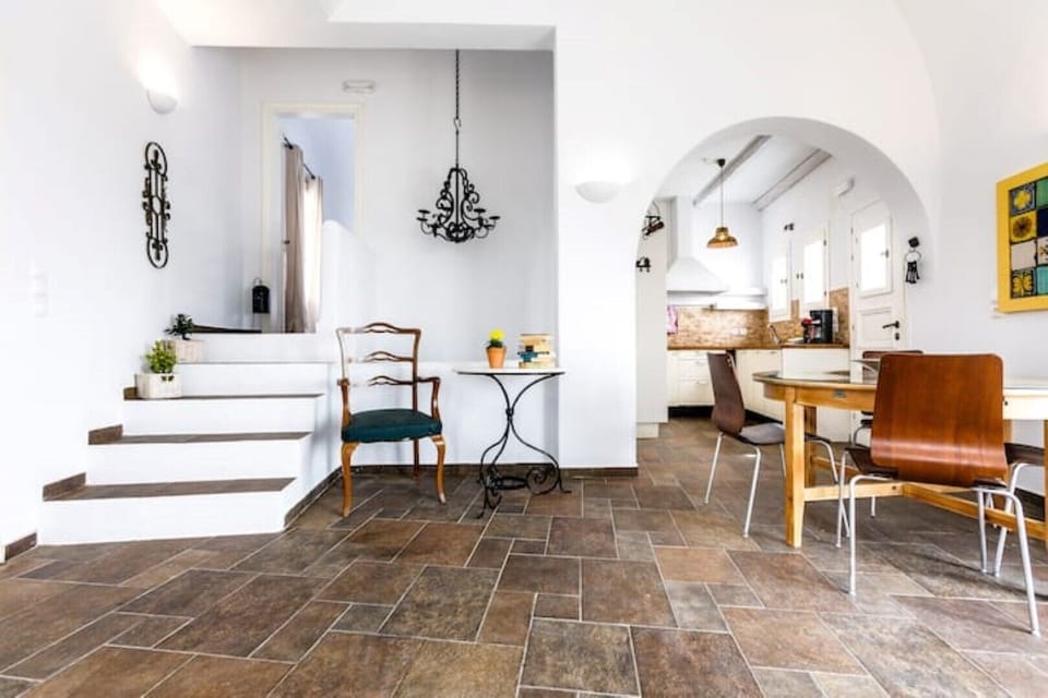 living room/dining space of  Villa Arcana I - steps guide into Master bedroom