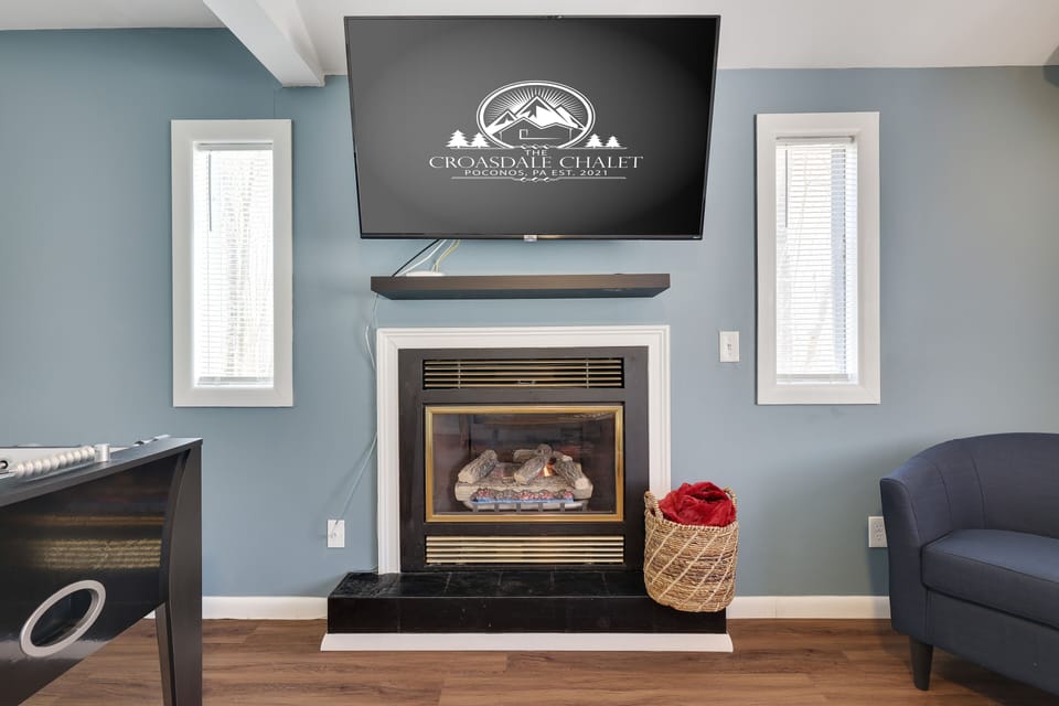 The lovely fireplace creates an intimate gathering setting. 