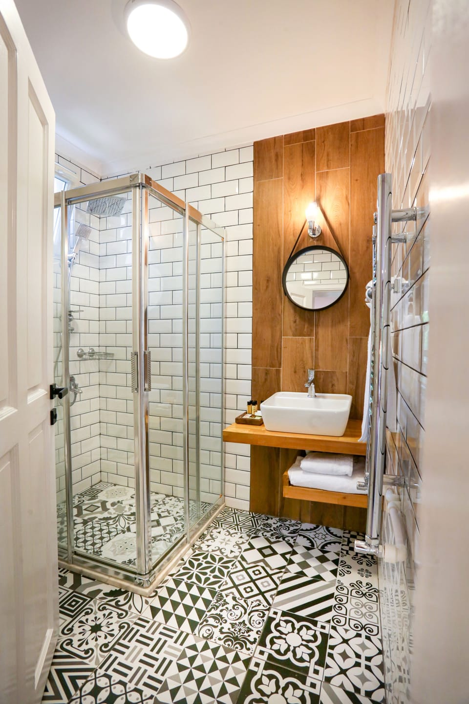 Shower, designer toiletries, hair dryer, towels