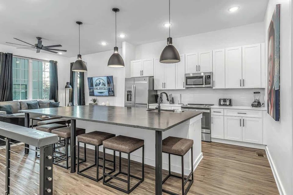 Open-concept kitchen and living area on level 2.