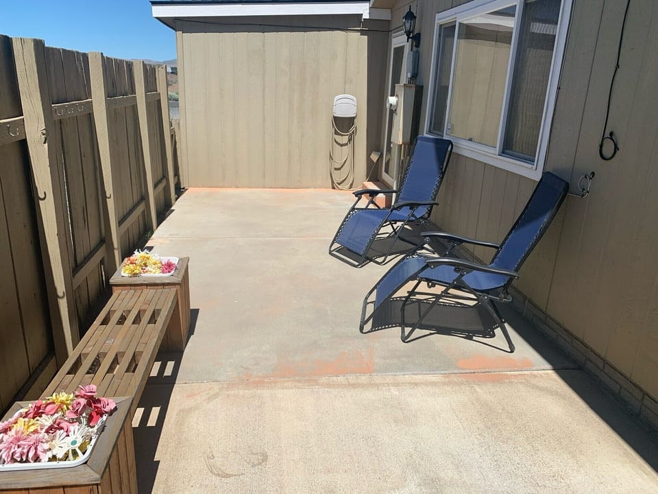 Enjoy the enclosed patio with lounge chairs