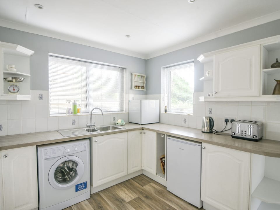 Fridge, microwave, cookware/dishes/utensils