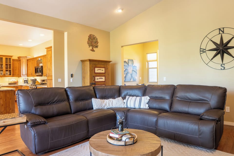 Take the second recliner in the main room while the sofa fills up, and you're still close enough to the kitchen to stay in on every conversation.