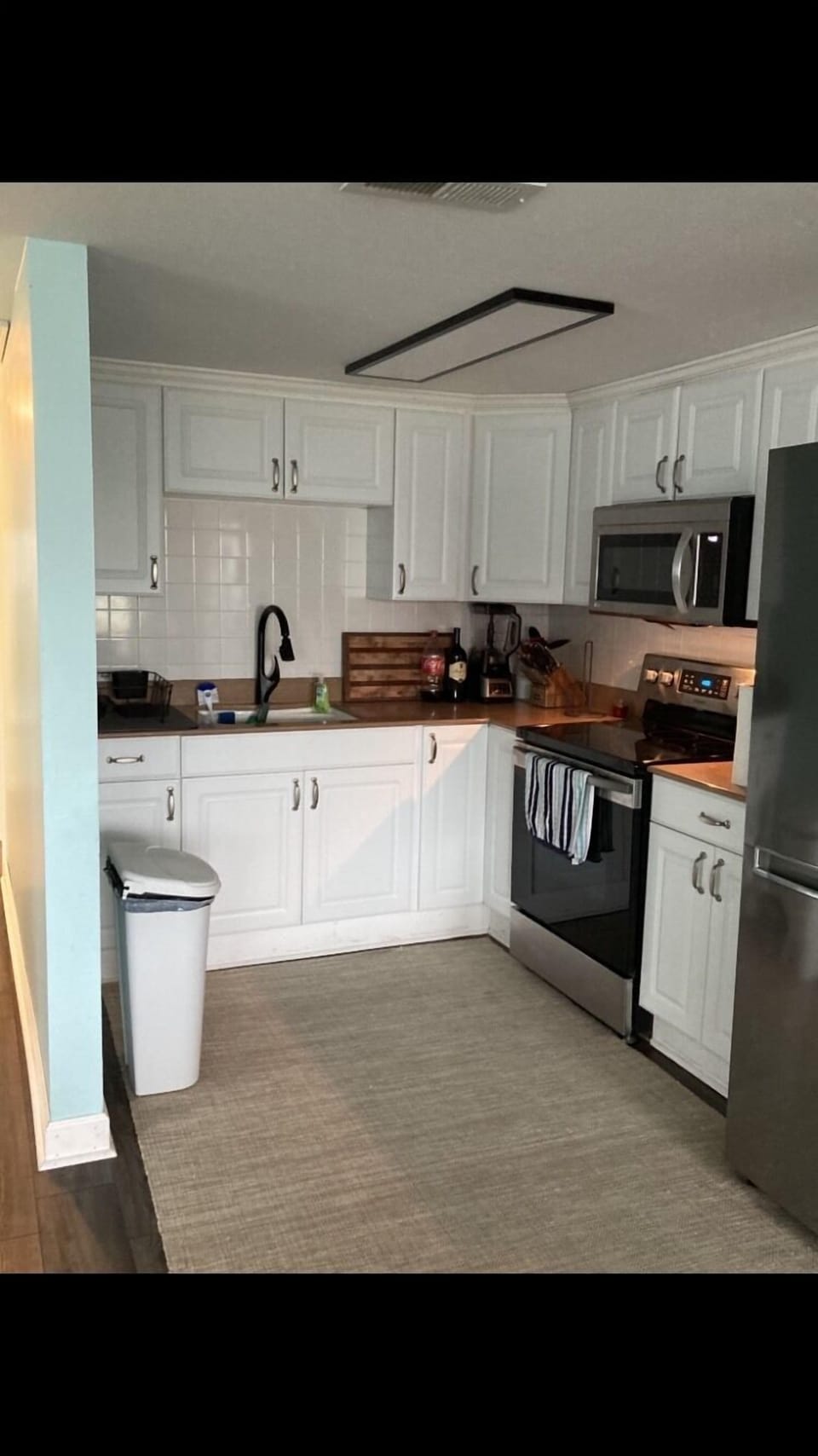 Kitchen cabinet has safety locks on doors - please use w small children