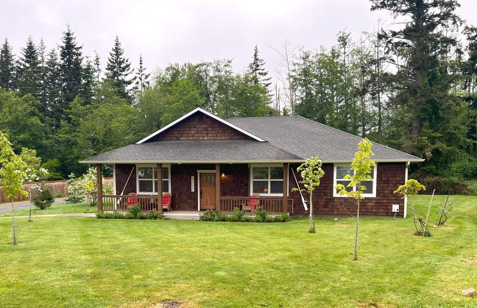 Spacious lot in a quiet neighborhood, nestled against an expansive forest