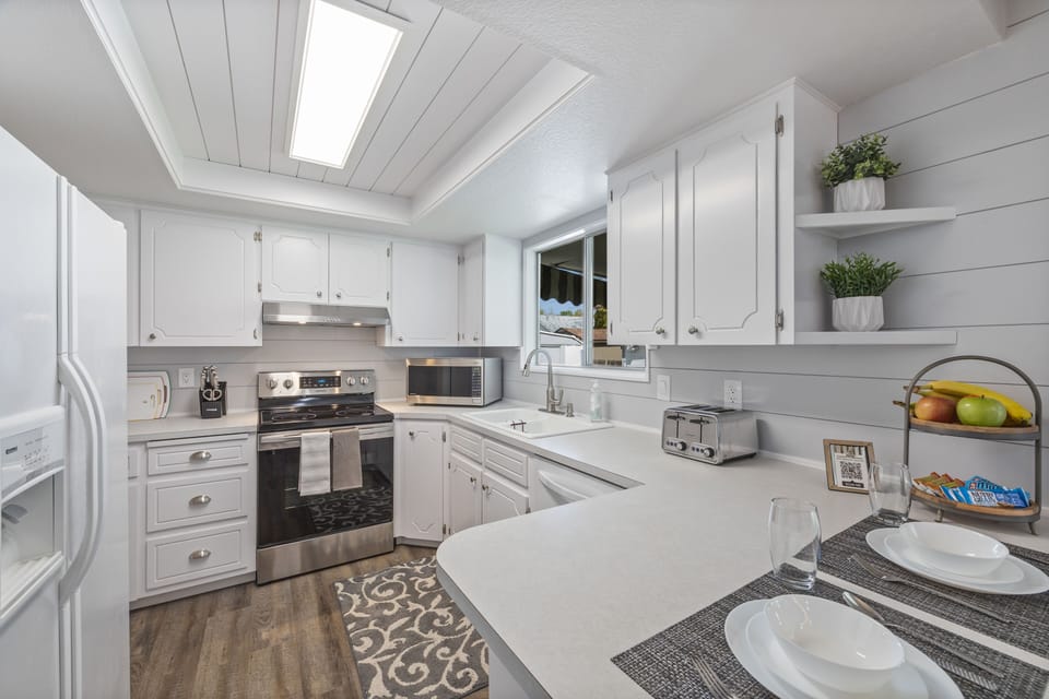 Kitchen with new stove, microwave, coffee maker, toaster snacks and much more