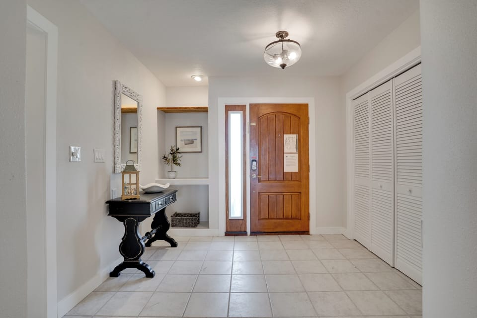Step into your welcoming entrance foyer, where elegant décor and warm lighting create the perfect first impression of your home away from home.