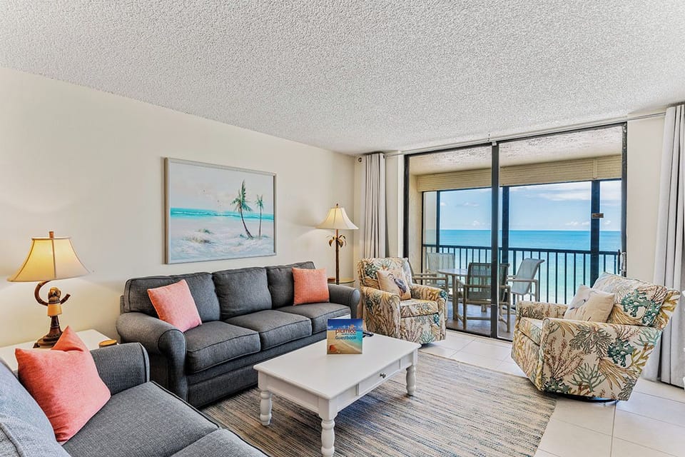 Relax in your bright living room with stunning ocean views from your private balcony.
