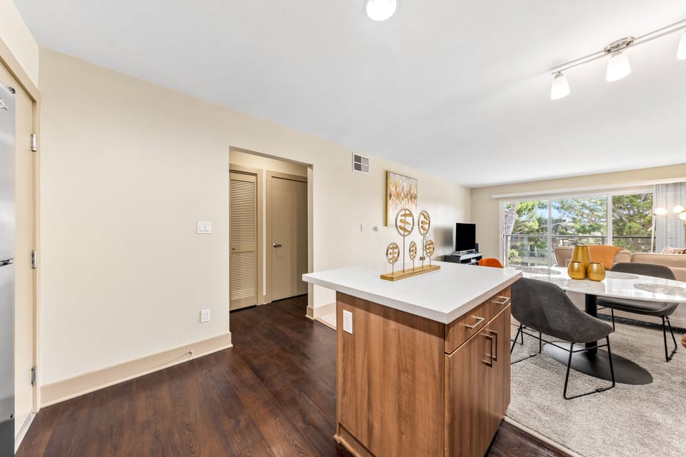Hardwood floors throughout the common areas add a touch of warmth.