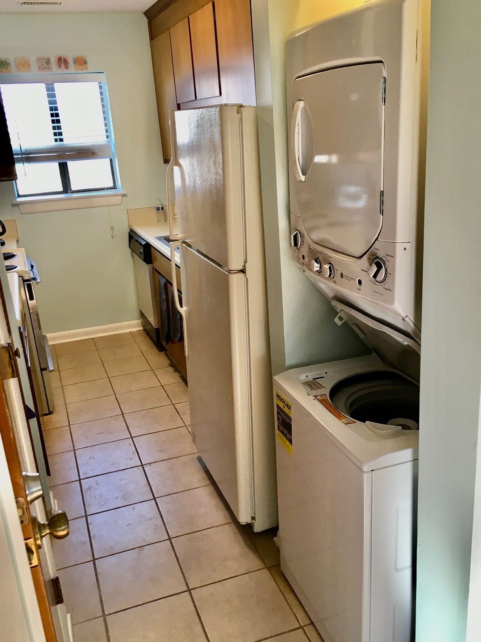 A full, well-stocked galley kitchen with a washer dryer.