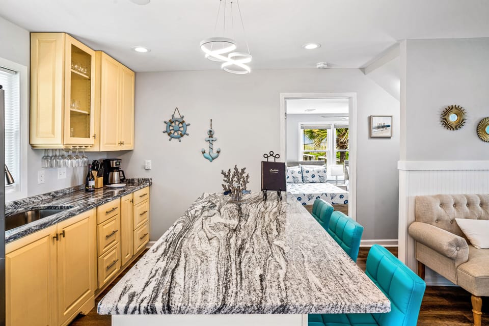 Main level wet bar area, full size refrigerator, and island for entertaining.