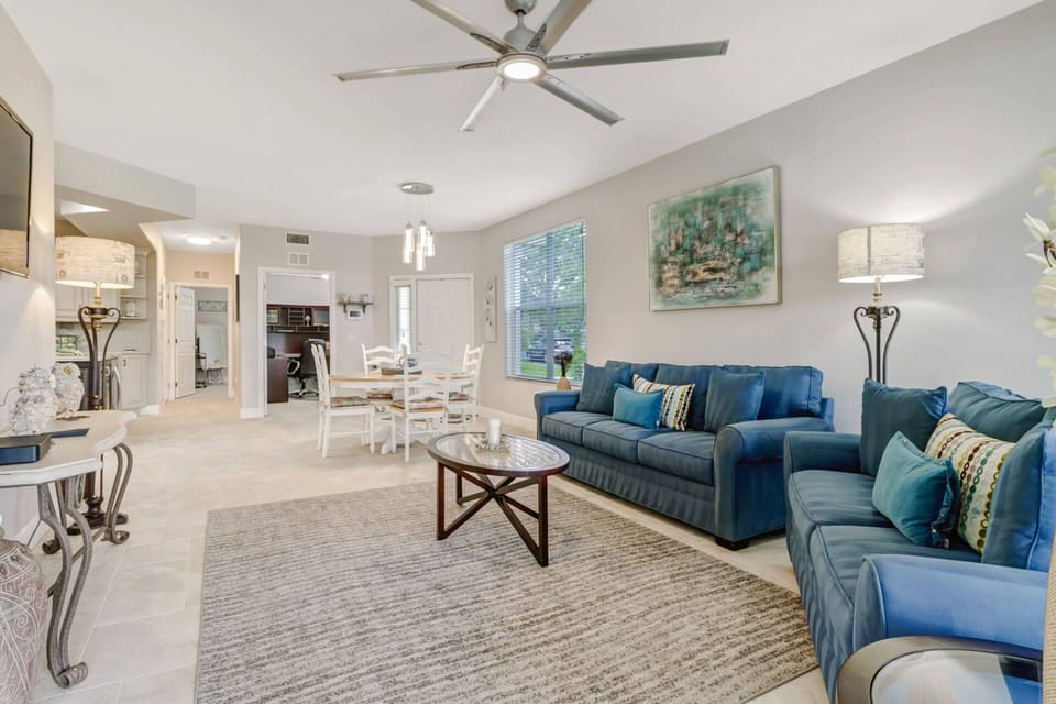 The open concept space includes a living room, dining area and kitchen, all comfortably furnished for 4 guests.
