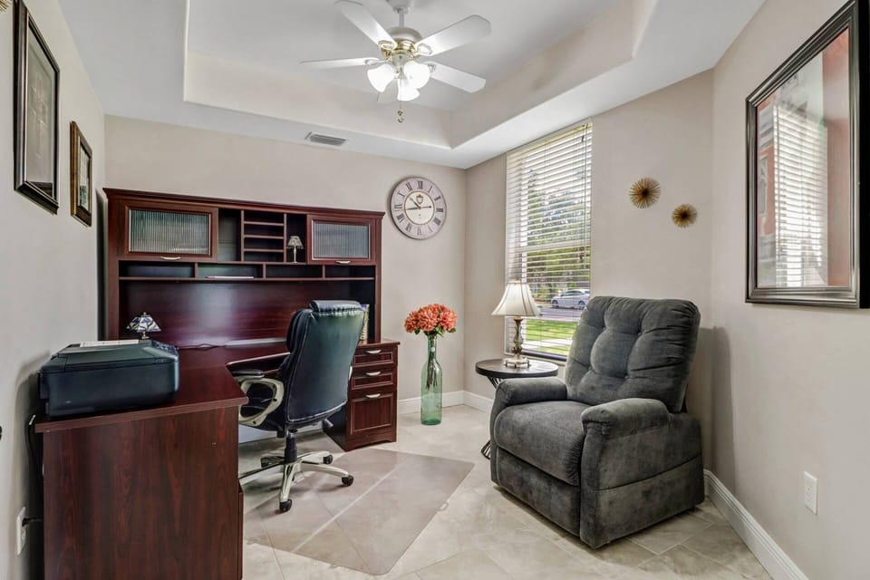 A full office/den at the front of the condo is a great spot to keep up with work or relax in the recliner with a book.