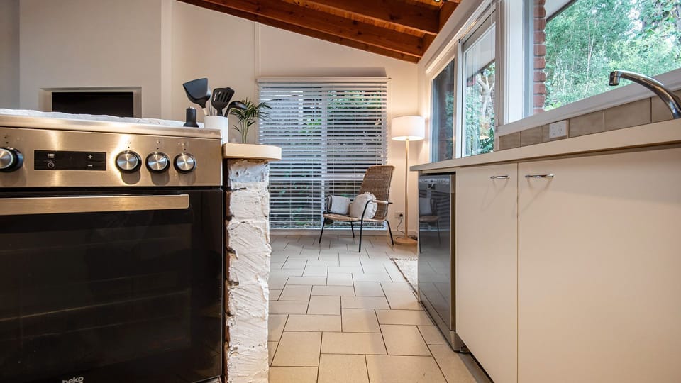The centerpiece of the kitchen is a spacious and versatile cooking area.
